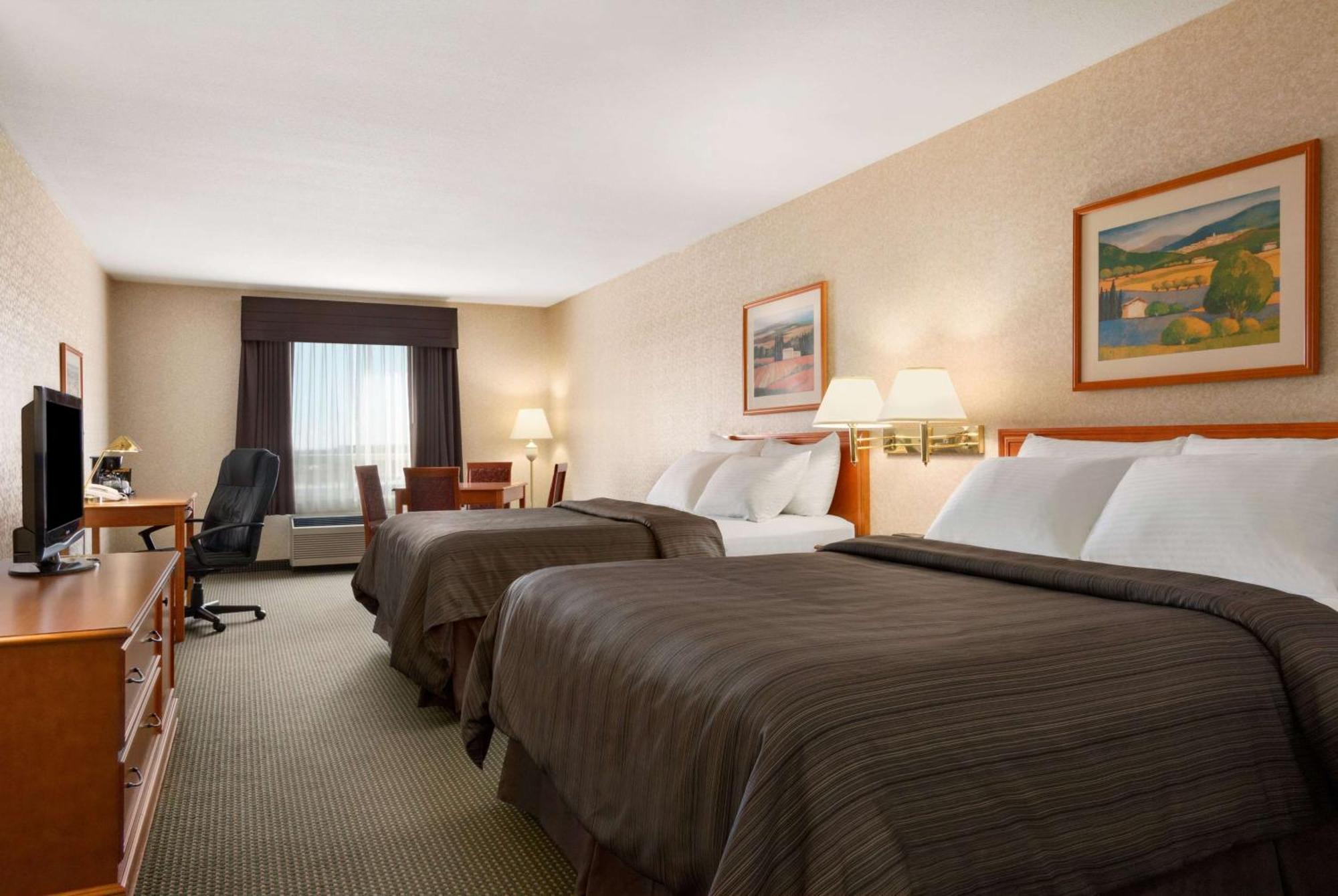 Deluxe Room with Two Queen Beds and One Sofa Bed - Non-Smoking